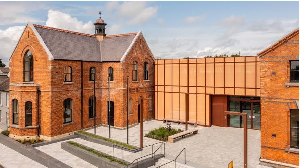 Louth County Council Civic Offices on Fair Street, Drogheda — Victorian red brick beside a copper-clad glass extension