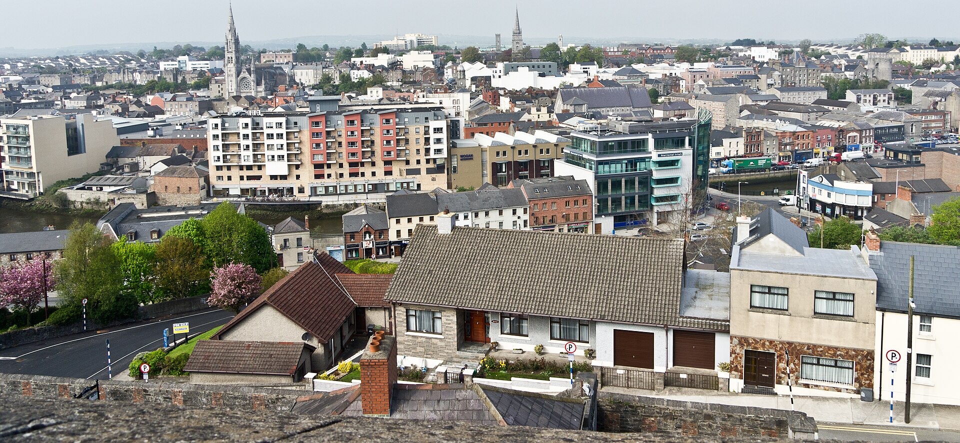 Panoramic view over the rooftops of Drogheda town centre from Millmount Fort, with church spires rising above the streets.